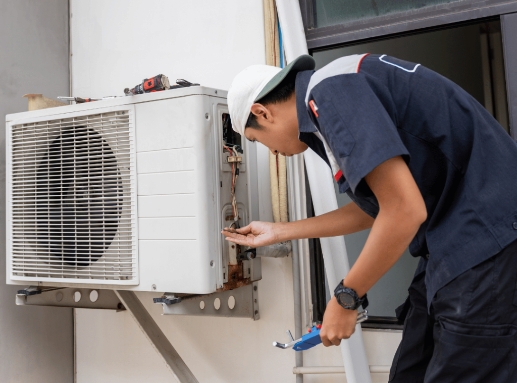 man checking ac conditioner during home inspection