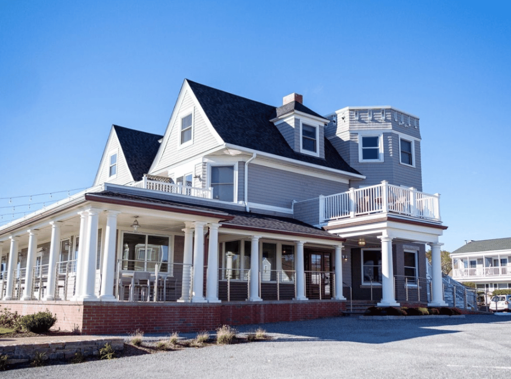 rhode island shore house with blue paneling and white accents