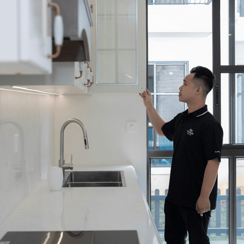 Man inspecting kitchen