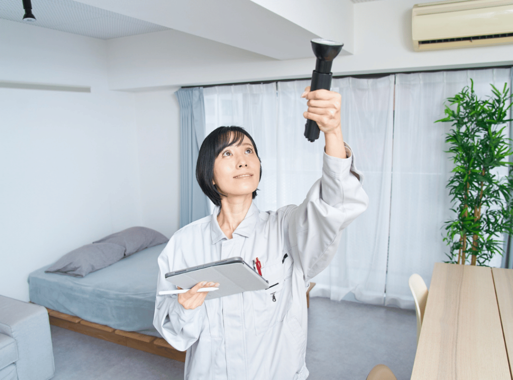 woman inspecting a roof during home inspection